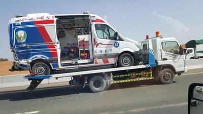 An emergency worker was injured when a motorist collided with an ambulance in Sharjah. Courtesy National Ambulance service