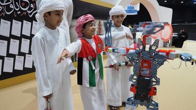 Sultan Ibrahim, 9, Hamdan Ali, also 9, and Hashem Mohammed, 8, enjoy the Abu Dhabi Family Forum. Delores Johnson / The National