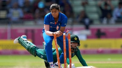 India's Radha Yadav, left, breaks the stumps to run-out Pakistan's Tuba Hassan. AP