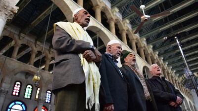 Syrian Muslim clergymen call for evening prayers at the Umayyad Mosque, the most ancient mosque in the old city of Damascus, Syria. EPA