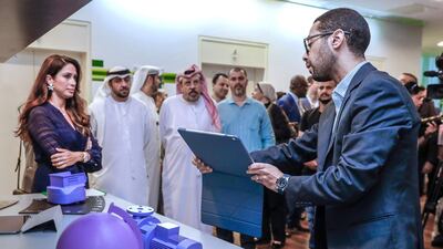 An Etisalat representative explains Industry 4.0 Augmented Reality to the visitors of the event.
