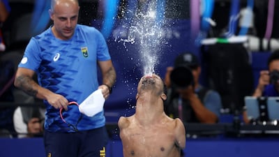 Gabriel celebrates his victory at the end of the men's S2 200m freestyle final event