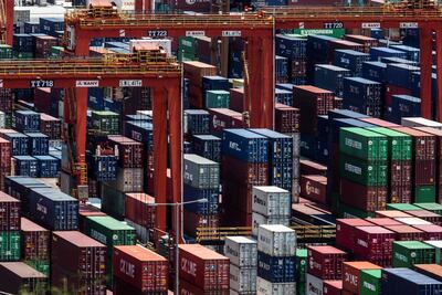 Shipping containers are seen stacked on top of each other at a cargo terminal in Hong Kong earlier this month. AFP
