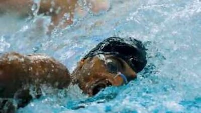 Obaid Ahmed Aljesmi, of the United Arab Emirates, competes in his men's 100m freestyle swimming heat at the National Aquatics Center during the Beijing 2008 Olympic Games.