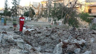 A Syrian medic inspects the damage at the site of a medical facility after it was hit by Syrian regime barrel bombs on October 1, 2016, in the rebel-held neighbourhood of Al Sakhour, in Aleppo. AFP / THAER MOHAMMED