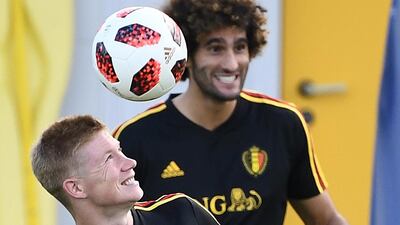 Belgium's midfielder Kevin De Bruyne (L) heads the ball next to Belgium's midfielder Marouane Fellaini during training session of Belgium's national football team at the Guchkovo Stadium in Dedovsk, outside Moscow, on July 8, 2018, ahead of their Russia 2018 World Cup semi-final football match against France. / AFP / FRANCK FIFE