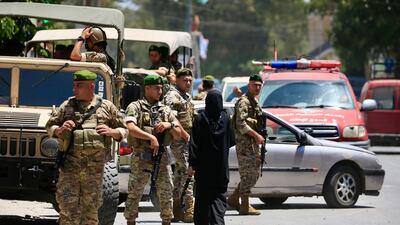 Lebanese soldiers secure the scene of an air strike in the southern town of Nabatieh on Friday. EPA