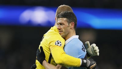 Football Soccer - Manchester City v Dynamo Kiev - UEFA Champions League Round of 16 Second Leg - Etihad Stadium, Manchester, England - 15/3/16Manchester City's Joe Hart and Martin Demichelis after the gameAction Images via Reuters / Jason CairnduffLivepicEDITORIAL USE ONLY.