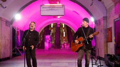 Bono and The Edge sing during a performance for Ukrainian people inside a subway station in Kyiv on May 8. Reuters