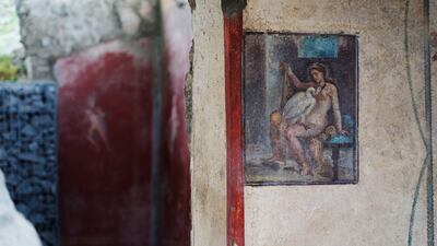 The 'Leda and the swan' fresco is seen on a wall at the Pompeii archaeological site in southern Italy, Tuesday, Feb. 15, 2022. In a few horrible hours, Pompeii went from being a vibrant city to a dead one, smothered by a furious volcanic eruption in 79 AD. Then in this century, Pompeii appeared alarmingly on the precipice of a second death, assailed by decades of neglect, mismanagement and scanty systematic maintenance of heavily visited ruins. (AP Photo / Gregorio Borgia)