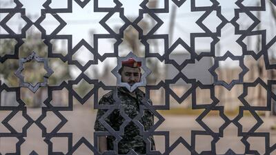 A Hamas Palestinian security guard stands at the closed entry to Rafah border crossing with Egypt, southern Gaza Strip. EPA