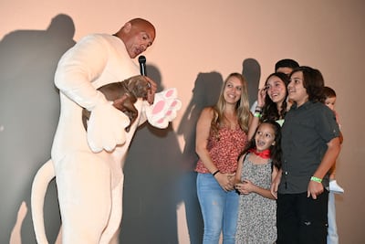 Dwayne Johnson surprising the Hernandez family with a pet puppy Quail at an LA screening of 'DC League of Super-Pets'. Stewart Cook/Shutterstock