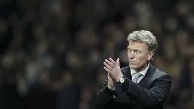 Manchester United manager David Moyes applauds supporters after their Champions League quarter-final first leg, 1-1 draw against Bayern Munich at Old Trafford on Tuesday night. Stefan Wermuth / Reuters / April 1, 2014
