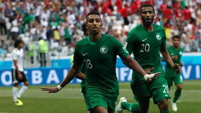Saudi Arabia's Salem Aldawsari, centrr, celebrates after scoring his side's second goal against Egypt. Darko Vojinovic /AP Photo