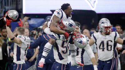 Patriots players celebrate their sixth Super Bowl title. AP Photo