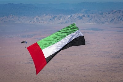 The Skydive Dubai team in 2019 broke the Guinness World Record for the largest flag flown in freefall, carrying a 144.28-square metre UAE flag. Photo: Mark Norman / Skydive Dubai