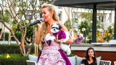 Boujie Paws Co's Dawn Appel with her pet Hepburn, wearing co-ordinated purple looks. Courtesy Boujie Paws Co