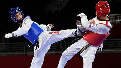 Tunisia's Mohamed Khalil Jendoubi (Blue) won silver in the taekwondo men's 58kg event..