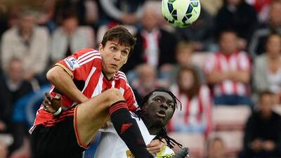 Santiago Vergini of Sunderland and Bafetibis Gomis of Swansea City compete for a header during their 0-0 Premier League draw on Saturday at the Stadium of Light. Nigel Roddis / Getty Images