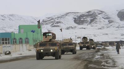 Afghan soldiers prepare to reach the scene of a plane crash near Ghazni, Afghanistan. EPA