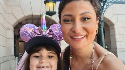 Sarah Agha at Disney land Paris in August 2022 with her daughter Ruby, 7.