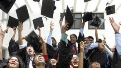 The graduating class of a university in Hyderabad throw their caps into the air. A reader suggests that the UAE offer scholarships and incentives to Indian specialists in maths and science.