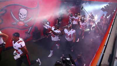 Tampa Bay Buccaneers players run to the field as they are introduced before Super Bowl LV against the Kansas City Chiefs at Raymond James Stadium. Reuters