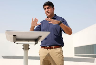 Jimmy Grewal, managing director for Dubai-based Elcome, shows off a Starlink connectivity device. Chris Whiteoak / The National