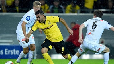 Ilkay Gundogan of Borussia Dortmund is challenged by Oliver Berg of Odd the UEFA Europa League Play-Off Round 2nd Leg match at Signal Iduna Park on August 27, 2015 in Dortmund, Germany. Lars Baron / Bongarts