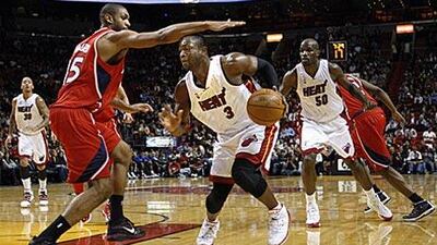 Miami Heat's Dwyane Wade drives to the basket against Atlanta Hawks during his side's victory.