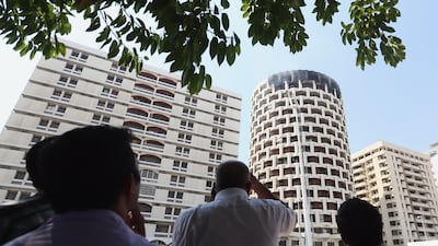 The tower, a concrete cylinder of interlocking squares, was completed in 1983. Delores Johnson / The National