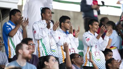 Audiences cheer the runners at the athletics competition at Dubai Police Academy Stadium. Reem Mohammed / The National