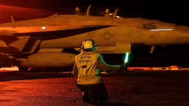 U.S. Sailors signal an F/A-18E Super Hornet on the deck of USS George H.W. Bush (CVN 77) as the aircraft carrier transits the Arabian Sea. The F/A-18E is a multirole fighter jet capable of conducting air-to-air and air-to-ground missions. Photo: Centcom