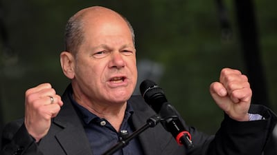 Olaf Scholz shouted over hecklers at an International Workers' Day event on Sunday. EPA