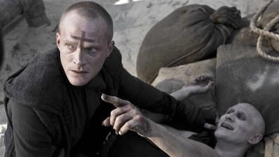 Priest (Paul Bettany, left) finishes off Familiar #1 (Josh Wingate) in Screen Gems' sci-fi action thriller PRIEST.