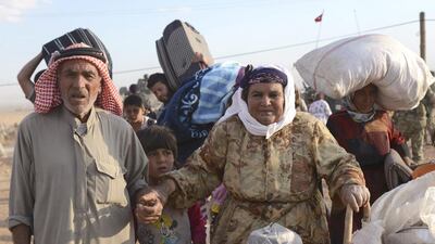 A Kurdish politician from Turkey who visited Kobani on Saturday said locals had told him that ISIL fighters were beheading people as they went from village to village. AP Photo