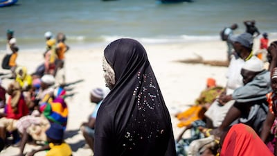 Man Yam, 19, stands on a beach waiting for aid distribution in the aftermath of a devastating cyclone, during Ramadan in Kumwamba village on Ibo Island, in Mozambique's Cabo Delgado province. AFP