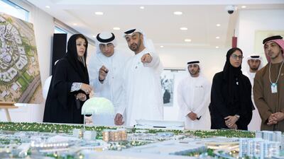 Sheikh Mohammed bin Zayed, Crown Prince of Abu Dhabi and Deputy Supreme Commander of the UAE Armed Forces (3rd L), visits the Expo 2020 main office in Jebel Ali. He is seen with Reem Ibrahim Al Hashimi, UAE Minister of State for International Cooperation (L), Sheikh Mansour bin Zayed, UAE Deputy Prime Minister and Minister of Presidential Affairs (R) and other executives. Hamad Al Mansoori for The Crown Prince Court