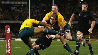 Cory Jane, centre, of New Zealand scores a try during a 2010 Bledisloe Cup match against Australia in Melbourne. Quinn Rooney / Getty Images