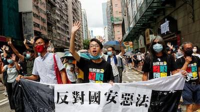 Pan-democratic legislator Eddie Chu Hoi-dick, Vice convener for Hong Kong's Civil Human Rights Front Figo Chan, and activist Leung Kwok-hung march at the anniversary of Hong Kong's handover to China from Britain on July 1. Reuters
