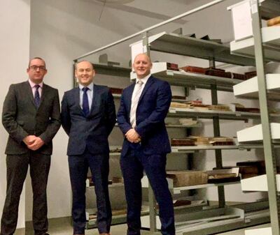 British police officers (left to right) Detective Constable Peter Duke, Detective Inspector Andy Durham; Det Con David Ward with some of the recovered books. Metropolitan police