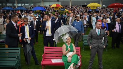 Racegoers watch the proceedings on day two of the Royal Ascot horse racing meet, in Ascot, west of London. AFP