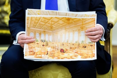 Donald Trump holds a rendering of the planned ballroom. Bloomberg
