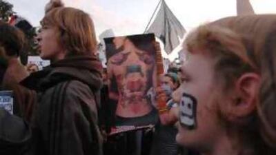 People gather in Moscow's Pushkin Square to protest against government moves that could shut down channel 2x2.