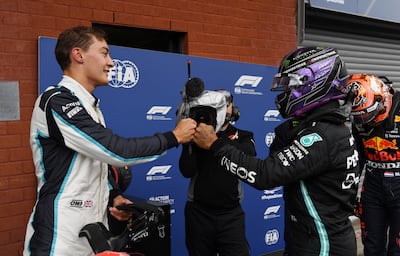 Mercedes' Lewis Hamilton and Williams' George Russell celebrate after finishing third and second in qualifying at August's Belgian Grand Prix. Reuters