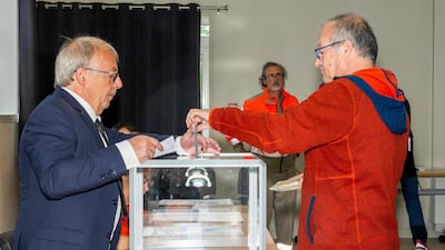 A voter casts his ballot at a polling station in Saint-Pierre, in the French northern Atlantic archipelago of Saint Pierre and Miquelon. AFP