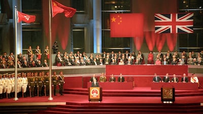 Former Chinese President Jiang Zemin addresses delegates following the raising of the Chinese and Hong Kong SAR flags on July 1, 1997, as Hong Kong returns to China after more than 156 years under British rule. AFP