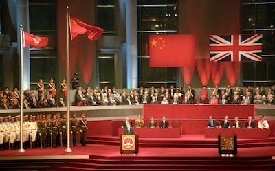 Former Chinese president Jiang Zemin addresses delegates following the raising of the Chinese and Hong Kong SAR flags on July 1, 1997, as Hong Kong returns to China after more than 156 years under British rule. AFP