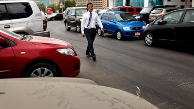 A reader urges residents to report abandoned cars through the Abu Dhabi CityGuard App. Rich-Joseph Facun / The National