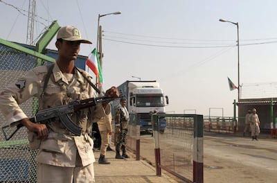 Iranian soldiers keep watch at a border post in Milak, south-eastern Iran, near the Afghan border. AFP